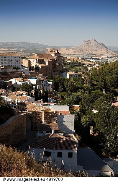 Partial view of Antequera highlighting the Iglesia del Carmen and the famous Peña de los Enamorados  Antequera  Andalusia  Spain