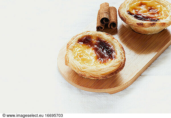 Pasteis de nata typical Portuguese dessert. White background and selective focus. Pastry concept