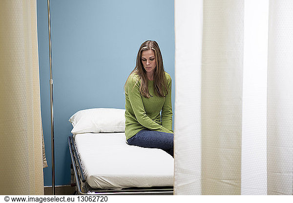 Patient sitting on bed in hospital