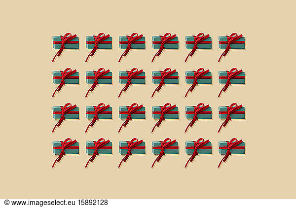 Pattern of Christmas presents against yellow background