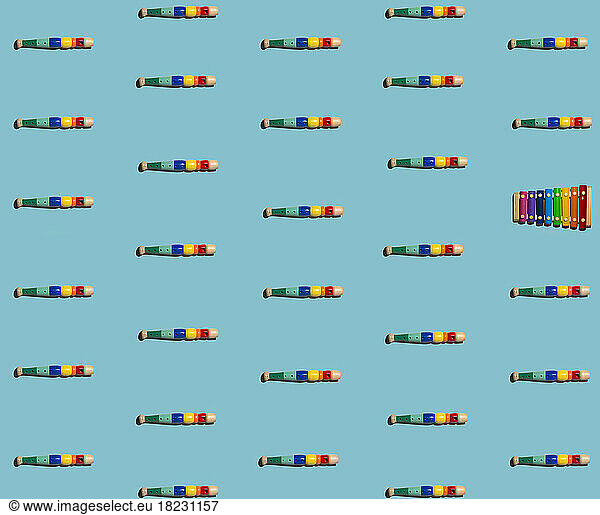 Pattern of colorful flutes with single xylophone