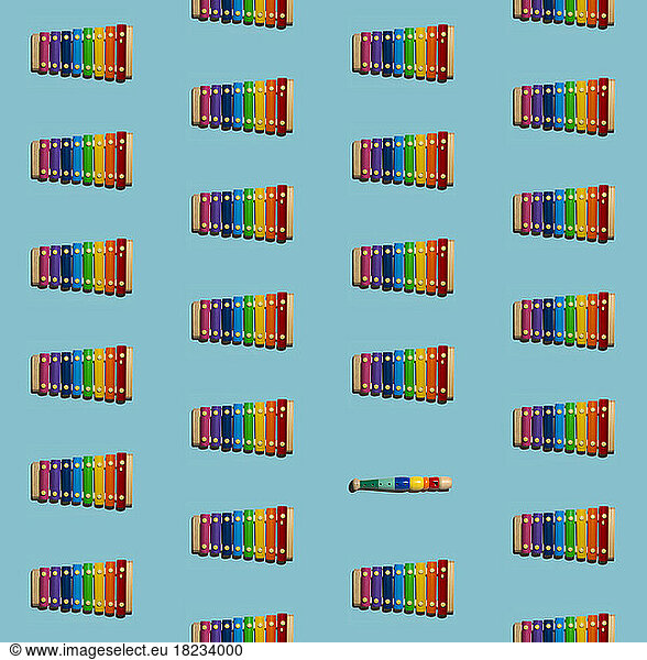 Pattern of colorful xylophones with single flute