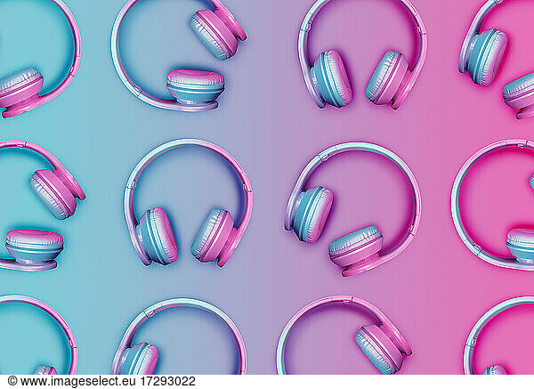 Pattern of rows of pink and blue wireless headphones