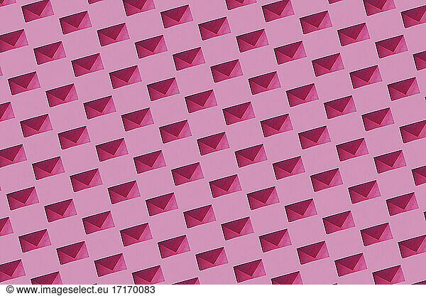 Pattern of rows of pink envelopes