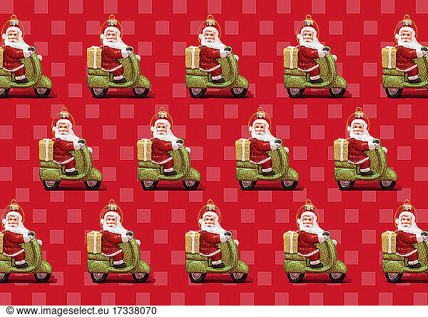 Pattern of Santa Claus Christmas ornaments against vibrant red checked background