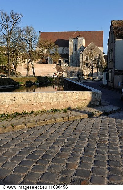 Paved street and collegiate church of St-Andre on the Eure River bank  Chartres  Eure-et-Loir department  Centre-Val de Loire region  France  Europe.