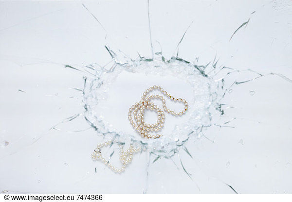Pearl Necklace and Broken Glass