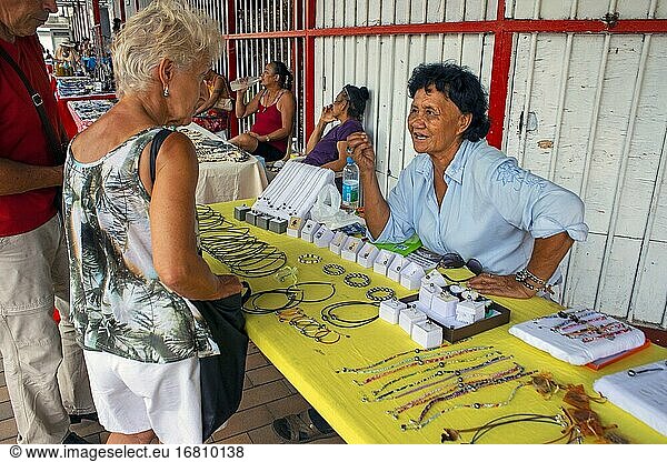 Pearls market in Papeete Tahiti French Polynesia. Tahiti black pearl farming demonstration. Farmer showing black lip oyster to cultivate the precious gem. Cultivation around the islands of French.