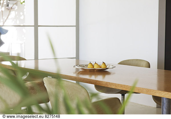 Pears in dish on dining room table
