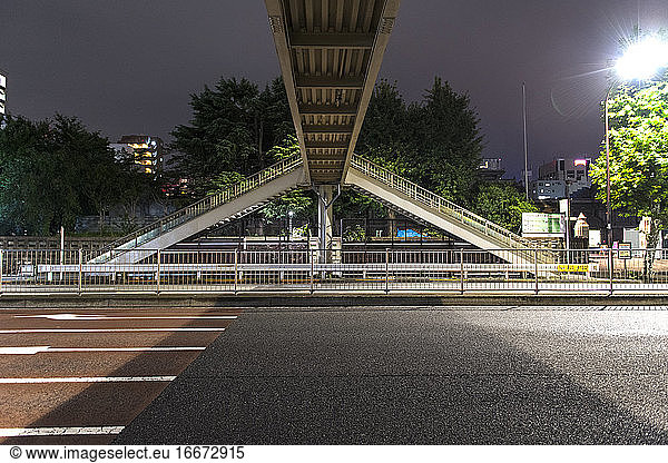 pedestrian bridge over empty road in Tokyo