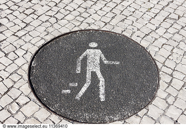 Pedestrian sign on sewage  Lisbon  Portugal
