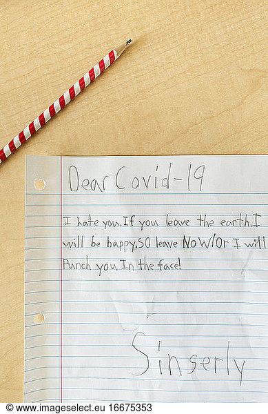 Pencil and Paper on Student's Desk Addressing Anger Toward Coronavirus