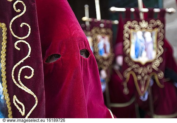 Penitent with traditional headgear  procession for Holy Week in Baeza  Jaen Province  Spain  Europe