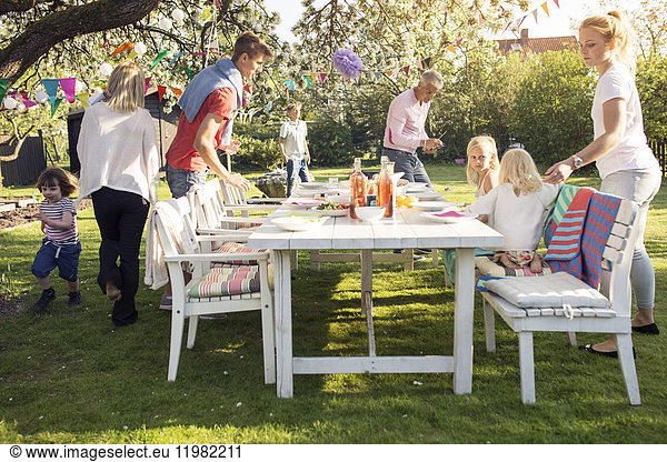 People around table at garden party