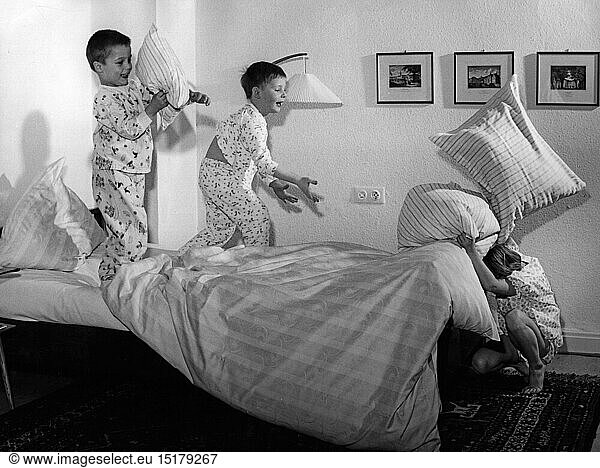 people  children  playing  three boys are playing in the bedroom  1950s