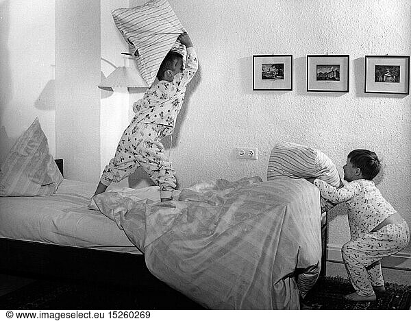 people  children  playing  two boys are playing in the bedroom  1950s