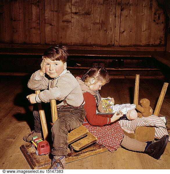 people  children  1950s  sibling at play  mountain farmer family