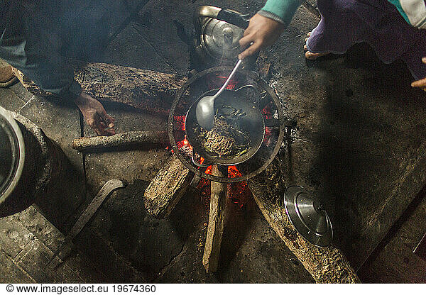 People cooking over campfire  Myanmar  Shan  Myanmar