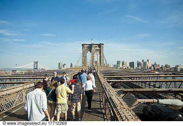 People Crossing Brooklyn Bridge Towards Brooklyn  New York  Usa
