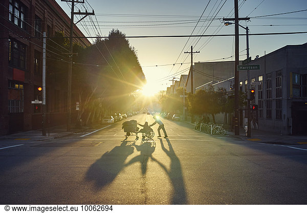 People crossing road at sunset  San Francisco  California  USA