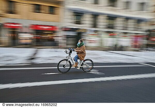 People cycling with snowy and empty Gran via Street on January 11  2021 in Madrid  Spain. Storm Filomena brought more than 50cm of snow to the Spanish capital  the most in decades.