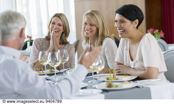 People enjoying meal in restaurant