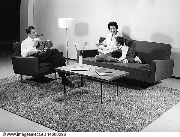 people  family  boy with parents sitting on a Chaise Lounge and armchair  Germany  circa 1959
