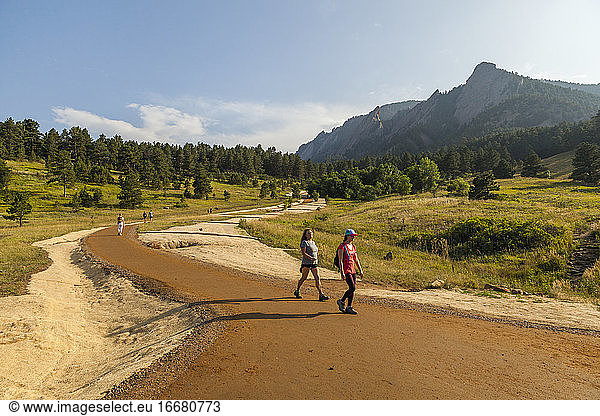 People hike on regraded trail in Chautauqua Park in Boulder  Colorado