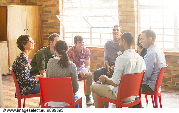 People in circle enjoying group therapy session