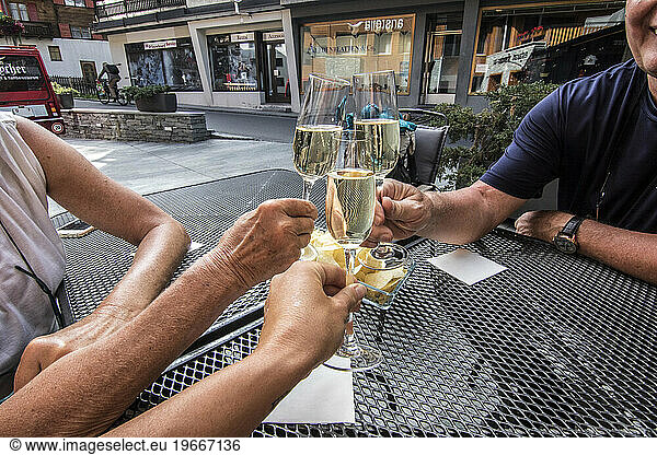 People making celebratory toast with champagne