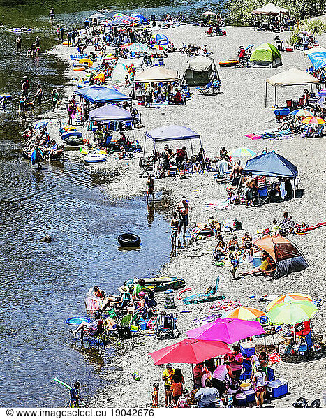 People on the beach along the Russian River.
