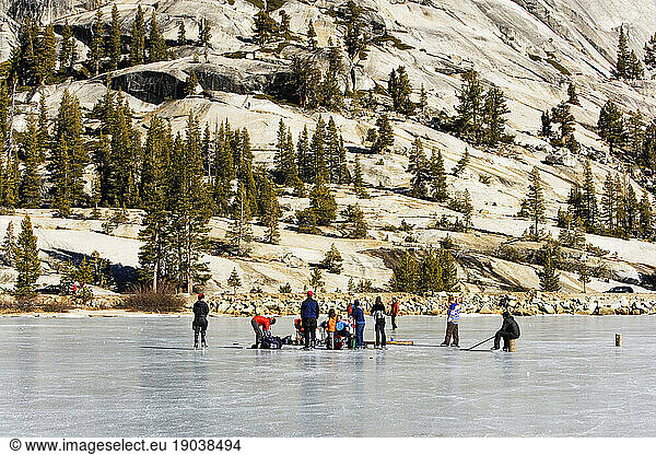 People picnicking on a frozen lake.