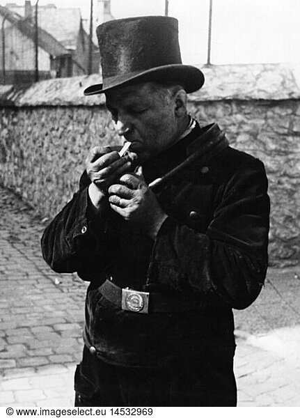 people  professions  chimney sweep  lighting a cigarette  West Germany  1960s