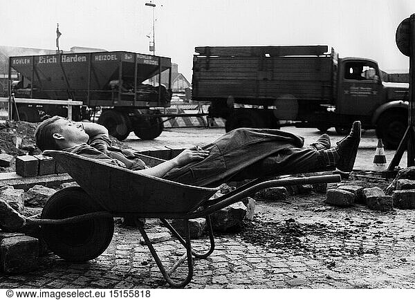 people  professions  construction worker  worker sleeping in wheel barrow during lunch break  Hamburg  May 1961