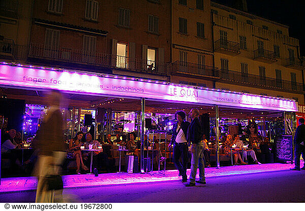 People sitting at a restaurant in the port  St. Tropez  Var  Provence  France.