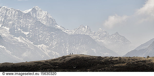 People trekking in the Himalayas near Machhermo  Solo Khumbu  Nepal