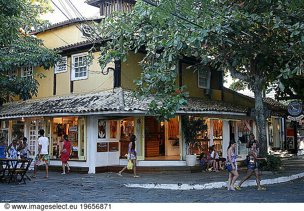 People walking at Rua das Pedras dotted with restaurants and boutiques  Buzios  Rio de Janeiro State  Brazil.