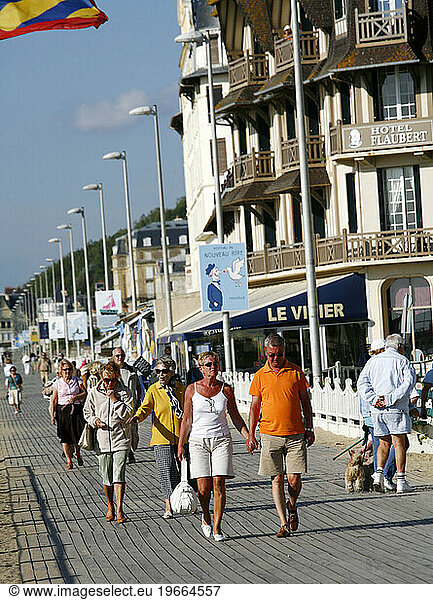 People walking by the beach on Trouville  Normandy  France.