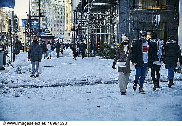 People walking for Snowy Gran Via Street on January 11  2021 in Madrid  Spain. Storm Filomena brought more than 50cm of snow to the Spanish capital  the most in decades.