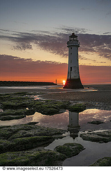 Perch Rock Lighthouse with setting sun  New Brighton  Cheshire  England  United Kingdom  Europe