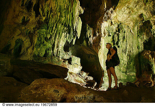 Person caving in Thailand.