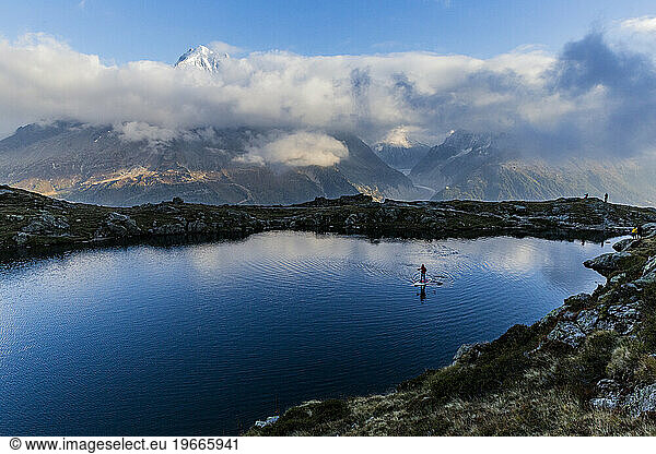 Person paddling on lac des Cheserys under lac Blanc in Chamonix  Haute Savoie  France