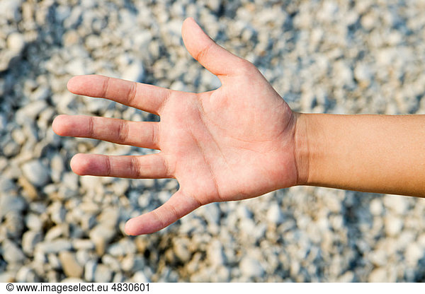 Person's palm against textured background