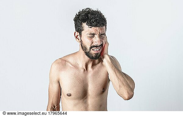 Person with earache on isolated background  man with earache on isolated background  ear disease concept