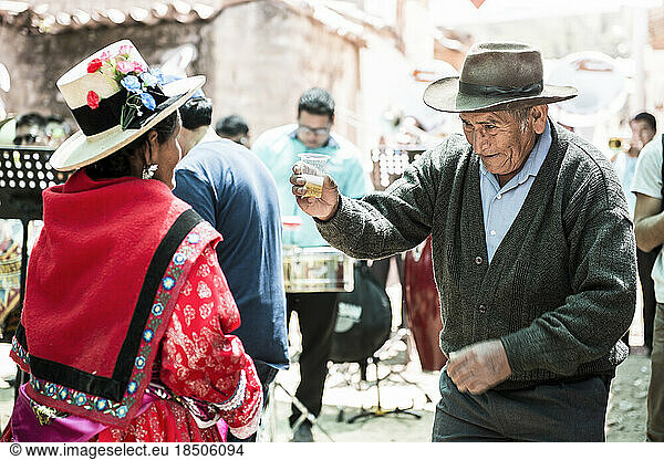Peruvian older man dancing during a traditional religious celebration