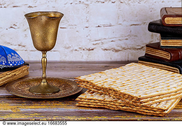 Pesah holiday celebration  matza unleavened bread and cup kosher wine