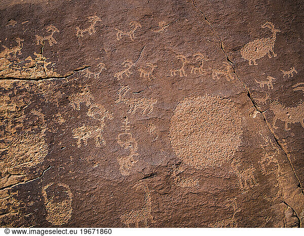 Petroglyphs on a rock wall.