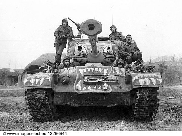 Photograph of soldiers sitting on a painted M-46 tank  the tank is painted to look like a fierce tiger. Taken during the Korean War  a war between the Republic of Korea (South Korea) and the Democratic People's Republic of Korea (North Korea)  in which a United Nations force dominated by the United States of America intervened to support the South and China intervened to support the North. Dated 1951