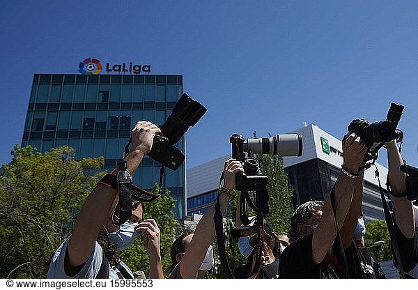 Photojournalists hold a banner that reads 'The Right to Information is not a Game' during a protest held at LaLiga headquarters in Madrid  Spain  28 May 2020  to denounce that the Spanish Professional Soccer League is preventing them from doing their job by banning them from training sessions and matches. LaLiga decided to ban photographers from matches and training sessions by providing media with handout photographs and video footage because of the coronavirus crisis..28 May 2020