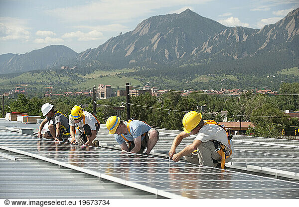 Photovoltaic installers on the world's first solar powered gym.